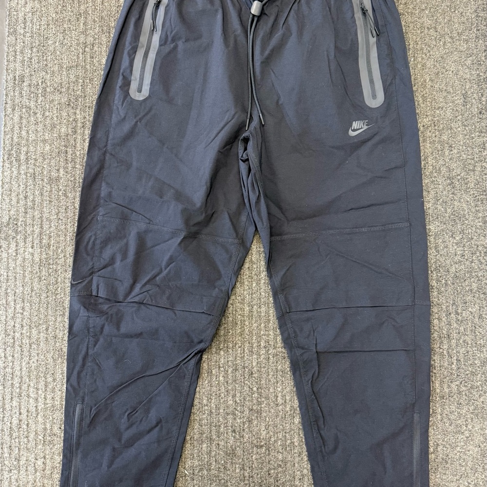 Nike Black Sweatpants with Elastic Waistband and Tapered Leg